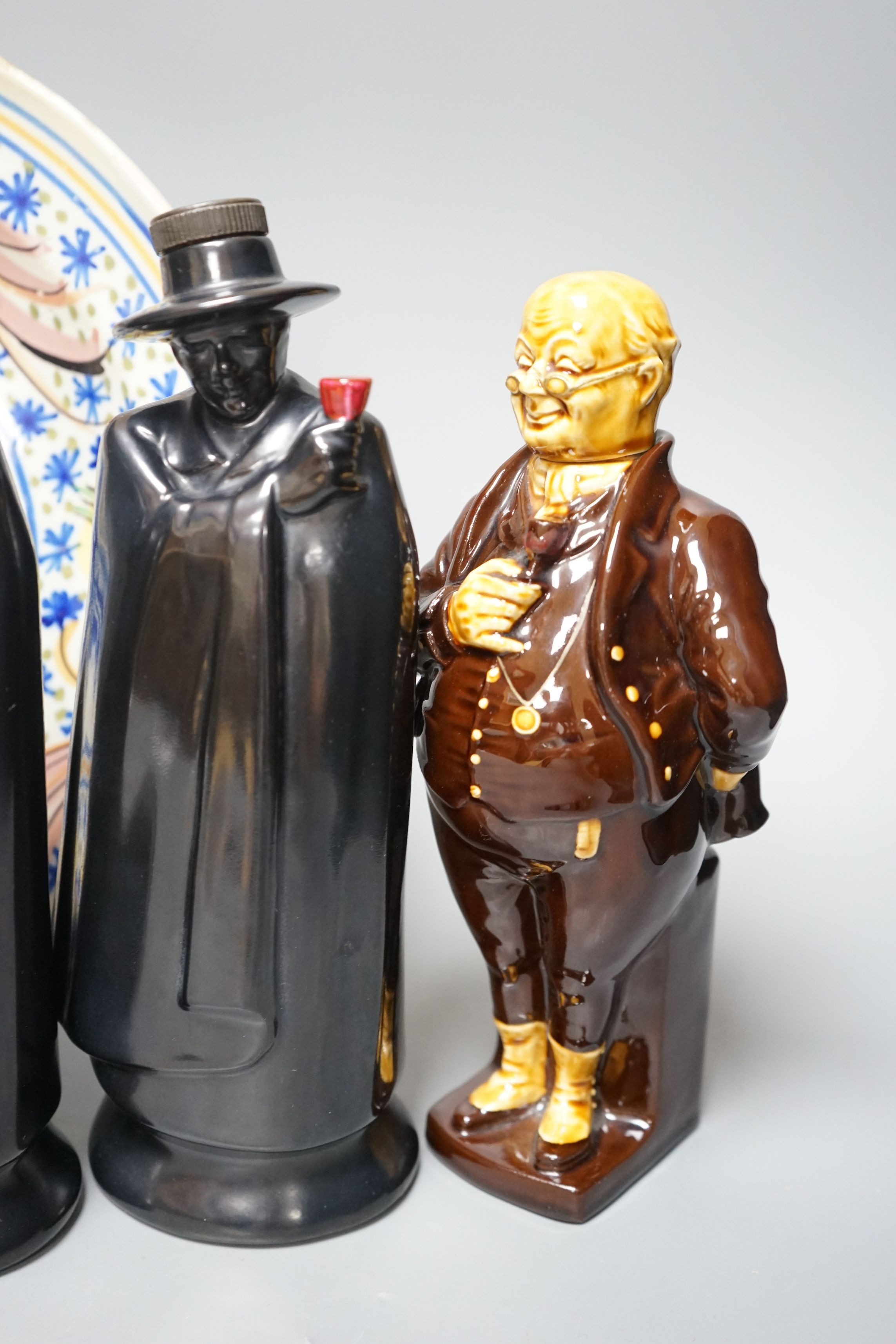 Two Doulton Sandeman bottles, a Dicken’s character bottle, and a Spanish maiolica dish, Sandeman bottles 27cms high